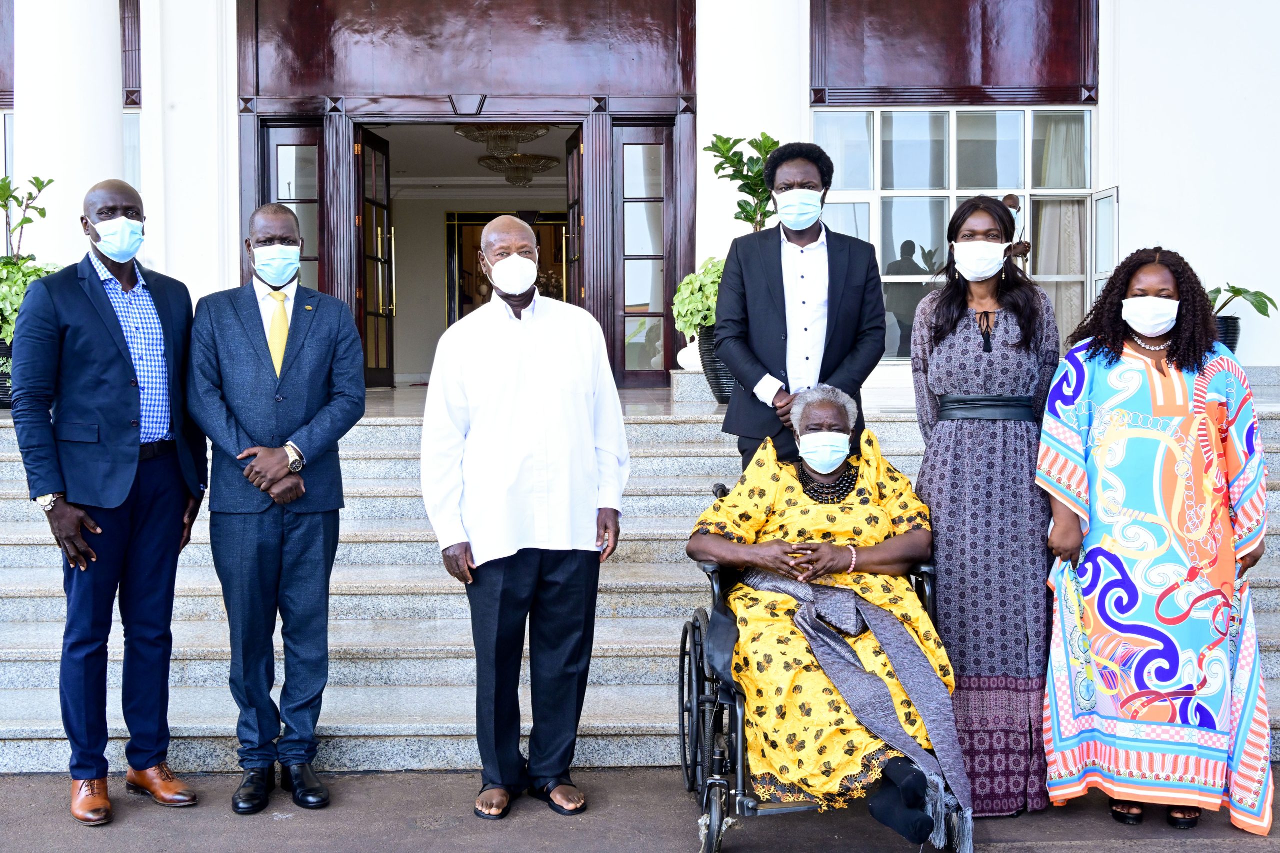 President Museveni poses for a photo with family members of the late Bazilio Olara Okello led by the widow Mrs Bazilio Olara Ataro (in wheel chair) after a meeting at State House Entebbe on Wednesday. PPU Photo