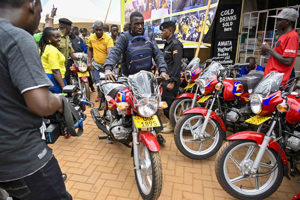 One of the beneficiaries moves away with one of the 36 boda bodas that are going to be received bythe 12 SACCOS in the Kampala Ghetto Structures each receiving 3 bikes, the State House Comptroller Jane Barekye was fulfilling the pledge made by President Yoweri Kaguta Museveni, the handover of the Boda Bodas took place in Bwaise- Kawempe Division in Kampala on the 4th September 2024. Photo by PPU/ Tony Rujuta.