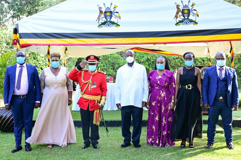 Brig. Gen Charles Kisembo and his family members pose for a photo with President Museveni during his retirement from the army at State House Entebbe on Tuesday Sept 24. PPU Photo