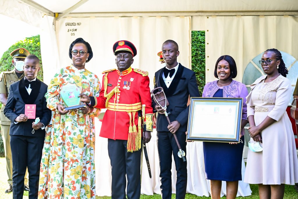 Brig Gen Godard Busingye and his family members pose for a photo after his retirement from the army at State House Entebbe on Tuesday Sept 24 PPU Photo