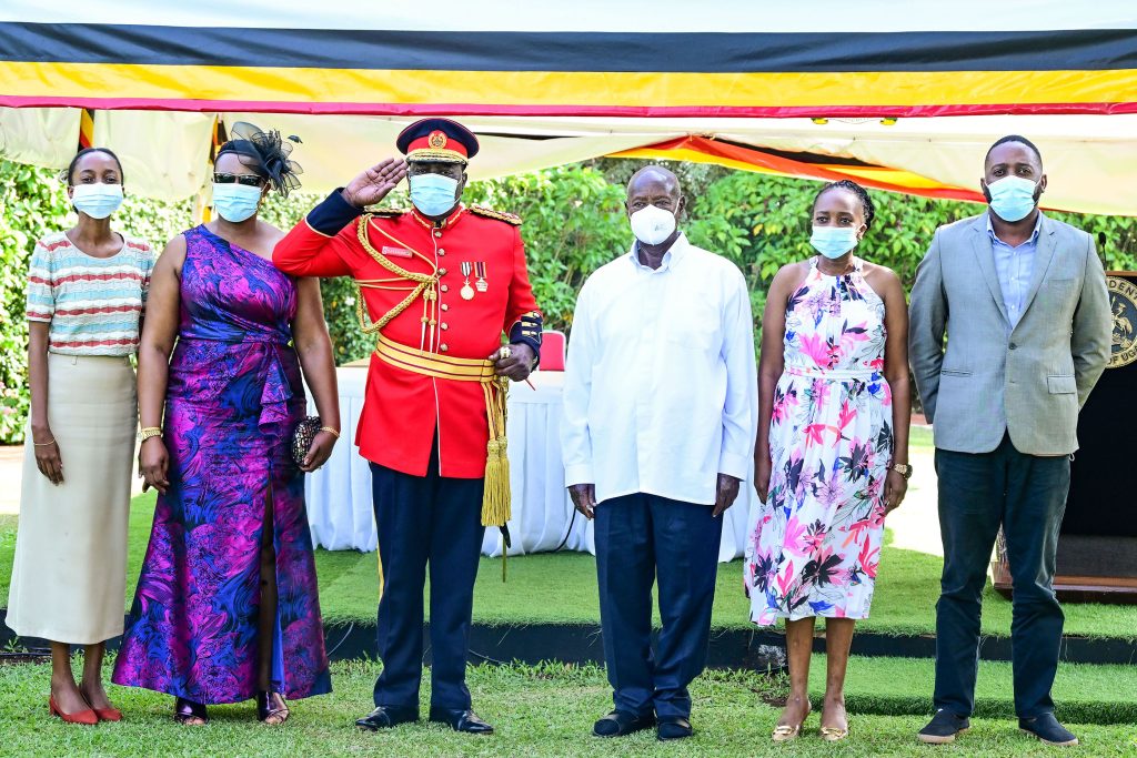 Maj Gen Silver Kayemba and his family members pose for a photo with President Museveni at State House Entebbe after retiring from the army on Tuesday Sept 24 PPU Photo