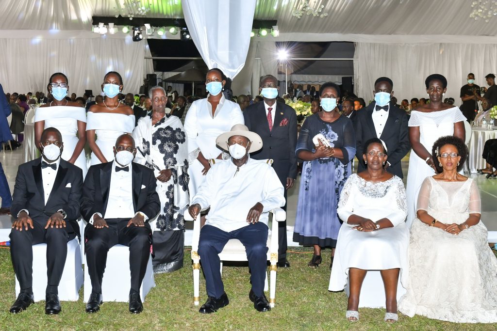 President Museveni (C) poses for a photo with Dr. Diana Atwine (2nd R), her husband Noah (3rd L) and their team during Atwine's 25th wedding anniversary at Serena Kigo on Saturday. PPU Photo