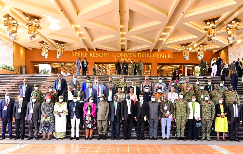 President Museveni (in hut) poses for a photo ministers, senior security officers and Gen Aronda's family members during the Aronda memorial lecture at Munyonyo on Tuesday. PPU Photo