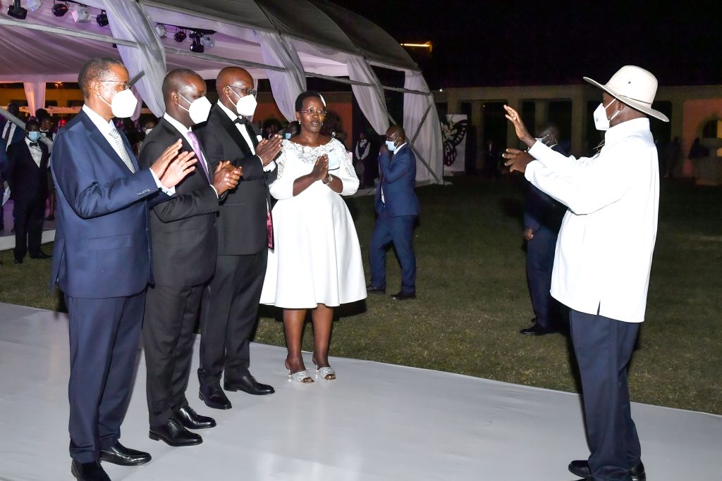 President Museveni (R) chats with Dr. Diana Atwine and her husband Noa (R) as Deputy Speaker Thomas Tayebwa and Deputy Chief Justice Richard Buteera (L) look on during Dr. Atwine's 25th wedding anniversary.