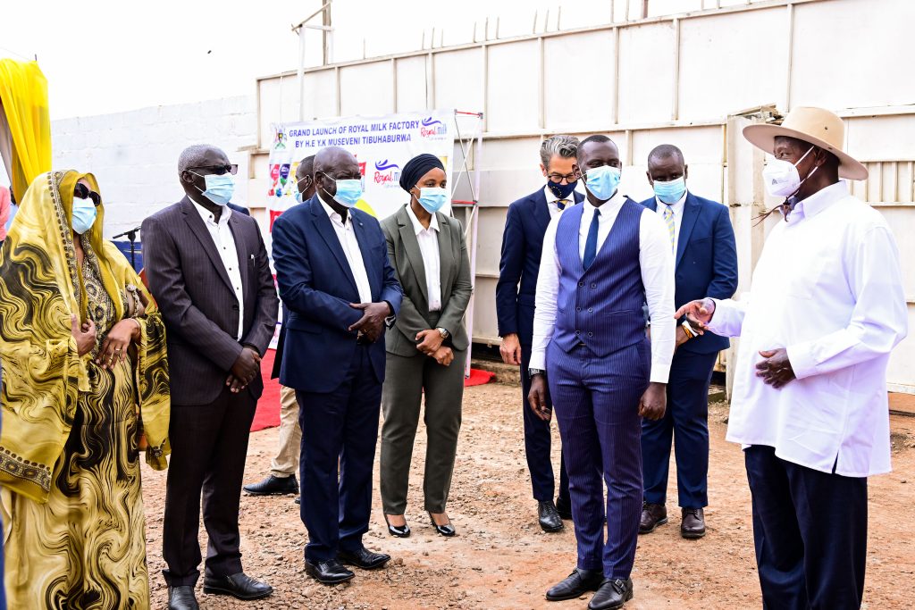 President Museveni chats with Royal Milk Factory MD Swaleh Kigoye and his parents L during the commissioning of the factory in Nalukolongo on Wednesday PPU Photo