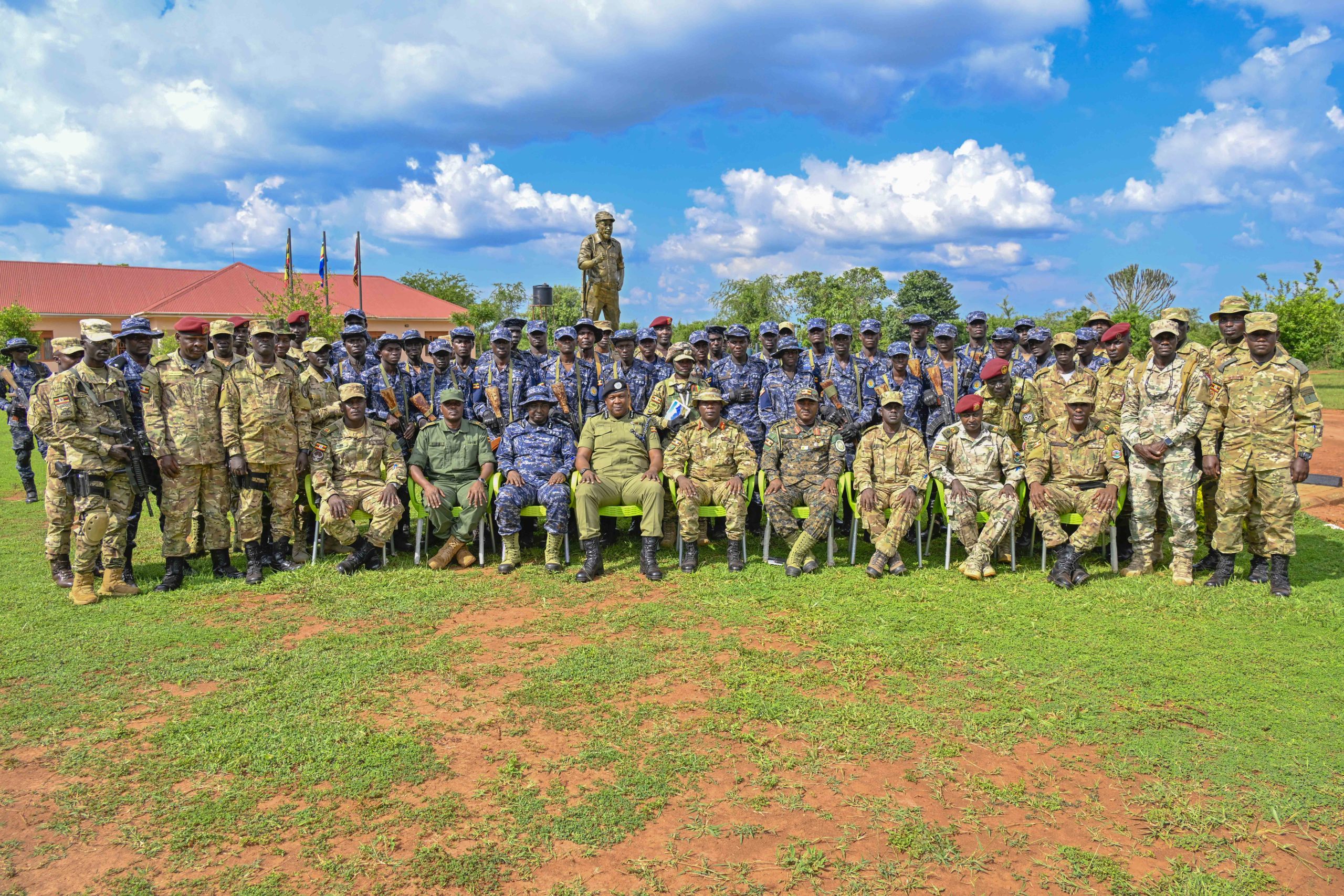 The Chief Guest Chief Of Staff Special Force Command Brig. Gen. Paul Namawa, Director Human Resource and Development and Training AIGP Moses Kafeero, Commandant Oliver Tambo Reginald leadership School Pan African Centre of Excellency Col. Justus Rukundo, Director of Training and Doctrine – SFC Lt. Col. Paul Micki Lokut, Police Presidential Guard Commander Lt. Col. Collins Kanyesigye, Commandant of Police Presidential Guard Special Force Training School Fort Samora Machel in Kaweweta Maj. Aloysious Nsobya and Officers in a group photo with PPG Trainees at Passes out Police Presidential Guard Special Force Training School Fort Samora Machel in Kaweweta on the 22nd October 2024. Photo by PPU/Tony Rujuta.