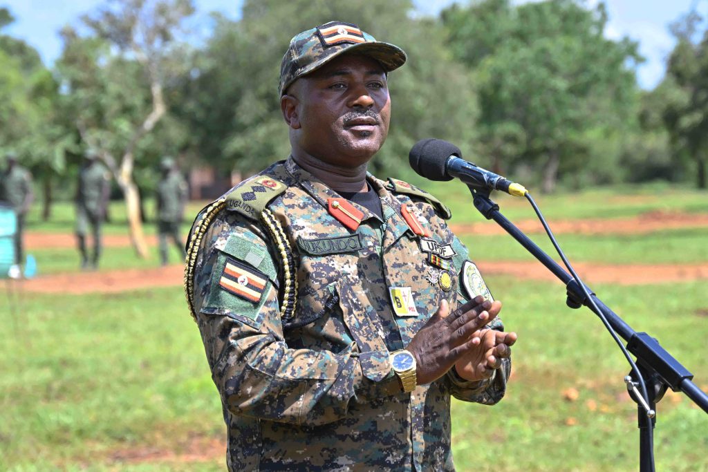 Commandant Oliver Tambo Reginald leadership School Pan African Centre of Excellency Col. Justus Rukundo making his remarks during the Passing out of PPG Trainees at the Police Presidential Guard  Special Force Training School Fort Samora Machel in Kaweweta on the 22nd October 2024. Photo by PPU/Tony Rujuta.