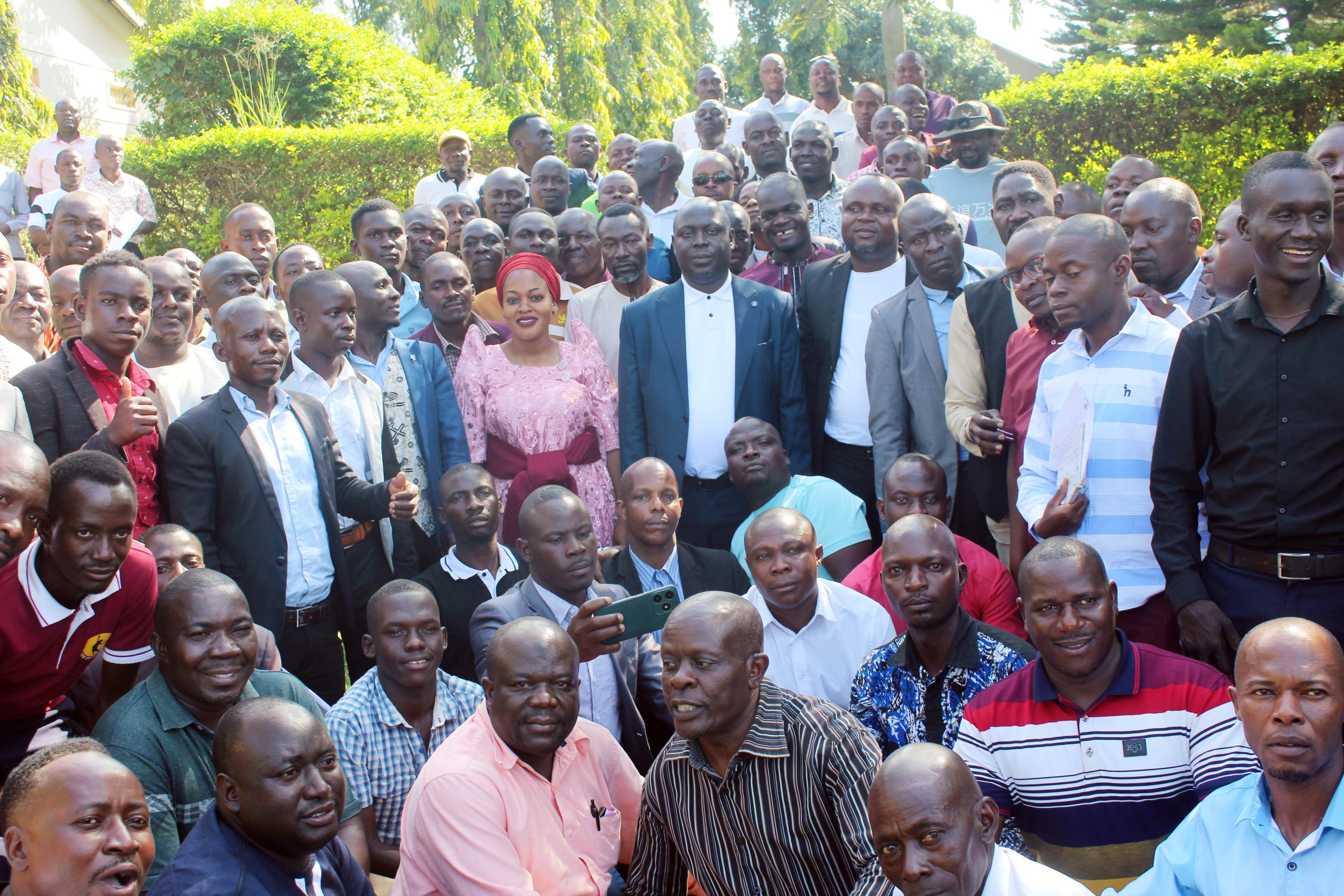 Iganga woman MP Sauda A. Kauma (in gomesi) and Farouk Kirunda (to her left) pose for a photo with Busoga Masters of Ceremonies (MCs) at Skyeez Hotel on Wednesday in Iganga town. (PHOTO BY GEORGE BITA)