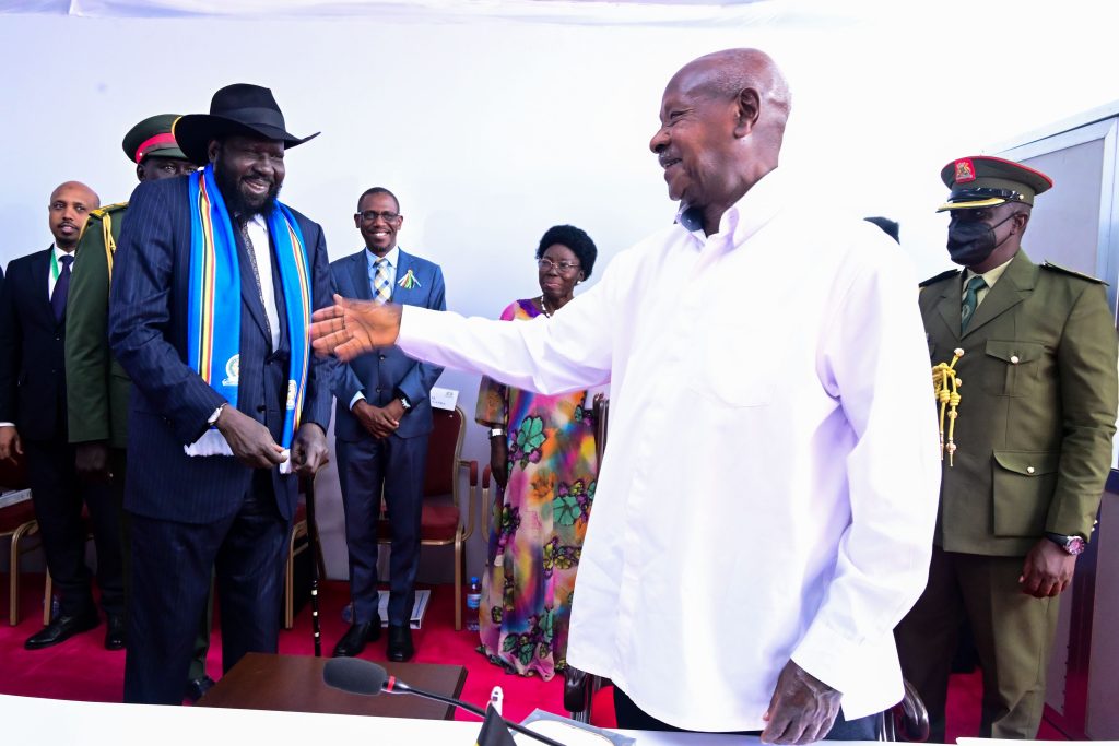 EAC President Museveni shares a light moment with outgoing EAC chairman President Salva Kiir of South Sudan during the EAC summit in Arusha on Saturday as other dignitories look on PPU Photo