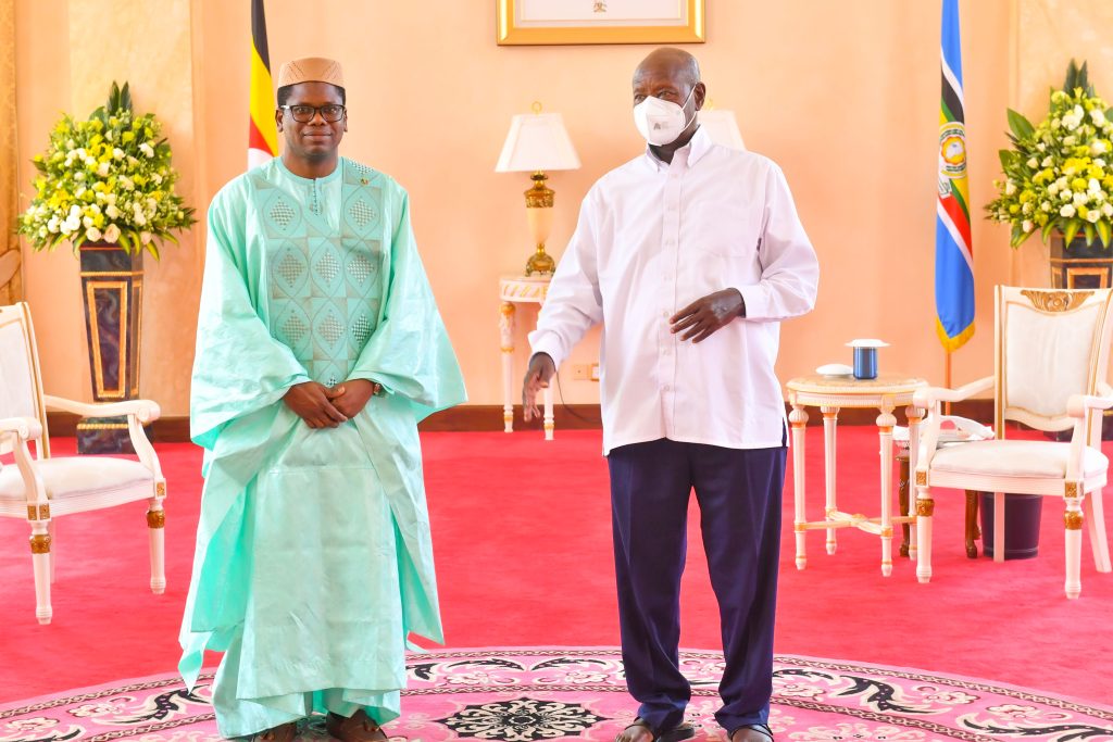 Mali's ambassador to Uganda Madou Diallo poses for a photo with President Museveni after presenting his credentials at State House Entebbe on Thursday PPU Photo