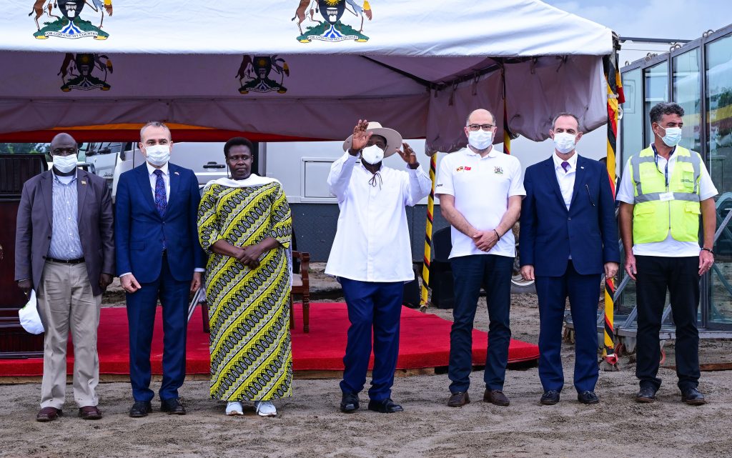 President Museveni poses for a photo with Yapi Merkezi chairman Erdem Arioglu 2nd R and his team R Standing L are VP Alupo Turkish amb to Uganda and Hon Katumba Wamala PPU Photo