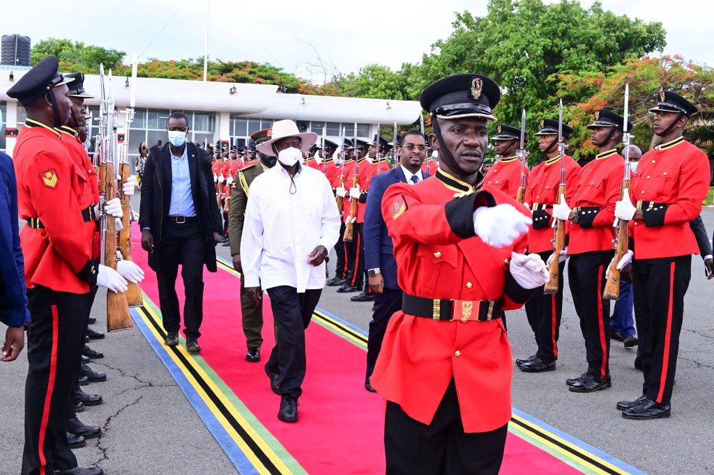 President Museveni walks through a military guard of honour as he departs Kilimanjaro International airport in Tanania for Entebbe after attending the EAC summit in Arusha PPU Photo