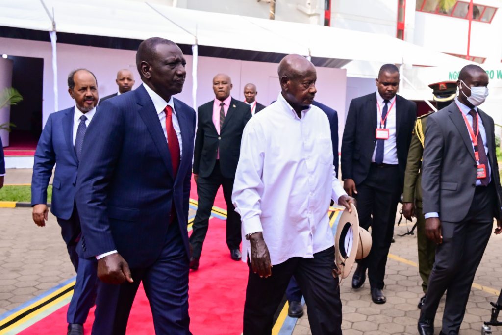 President Museveni and William Ruto of Kenya share a light moment during the EAC summit in Arusha Tanzania on Friday as Somalias Hassan Sheikh Mohamud L looks on PPU Photo