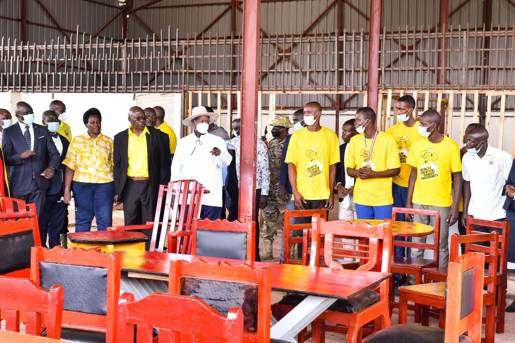 President Museveni accompanied by several leaders inspects some of the carpentry products made by the youths at the Bugisu Industrial Hub in Lukhonge Mbale district on Wednesday shortly after commissioning the Presidential Industrial Hub