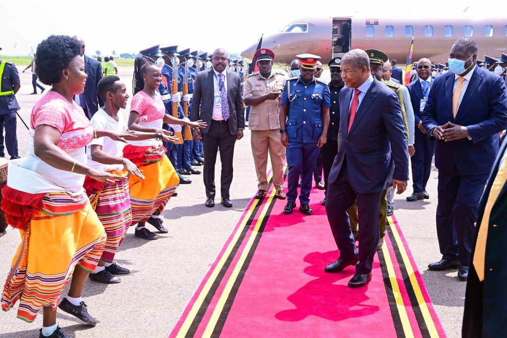 Angola's President Joao Lourenco is entertained by local perforemers on his arrival at Entebbe International Airport for the AU Summit on Friday. Looking on (R) is Defence Minister Jacob Oboth. PPU Photo