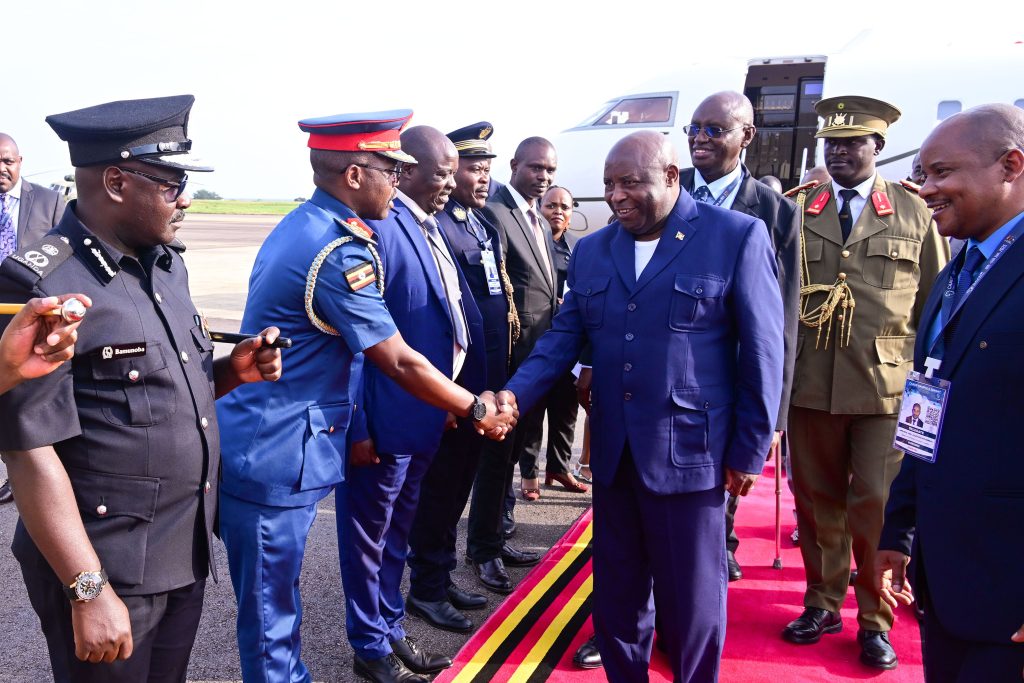 Burundi's President Evariste Ndayishimiye is greeted by Brig Gen. Gonyi on his arrival at Entebbe airport on Friday as other senior military officers look on. PPU Photo