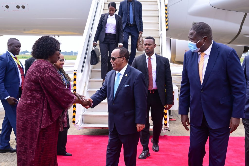 Uganda's ambassadfor to the AU Rebecca Otengo receives Ethiopia's President Taye Atske Selassie at Entebbe International Airport as Defence Minister Jacob Oboth looks on.  PPU Photo