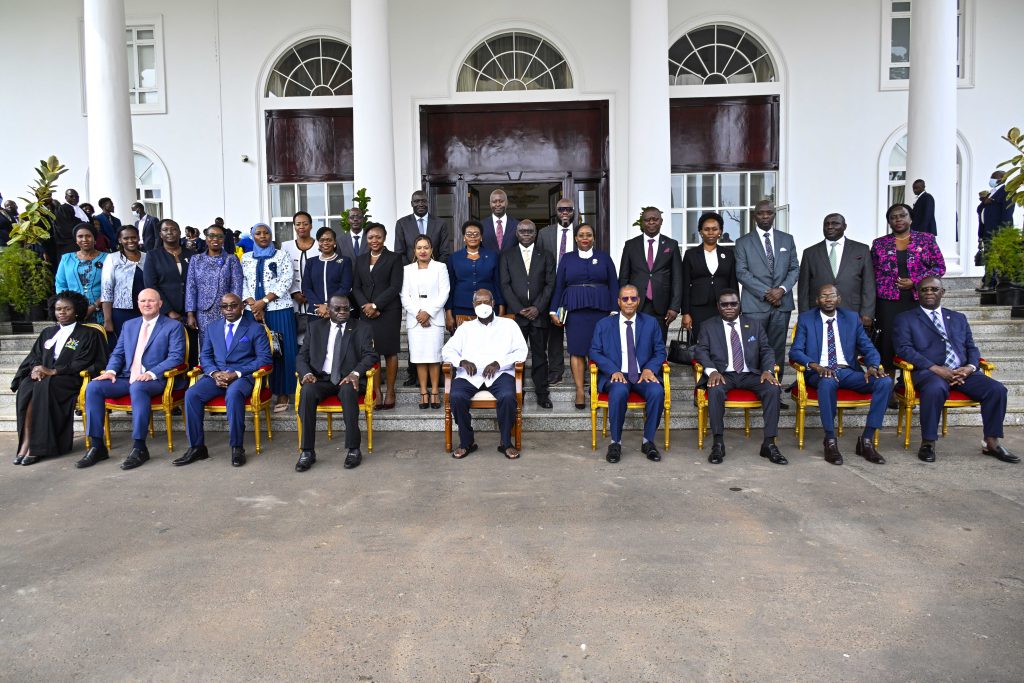 President Yoweri Kaguta Museveni in a group photo with the 21 newly Sworn in Acting Judges of the High Court (standing) at the State House Entebbe on the 4th March 2025. Photo by PPU/ Tony Rujuta.