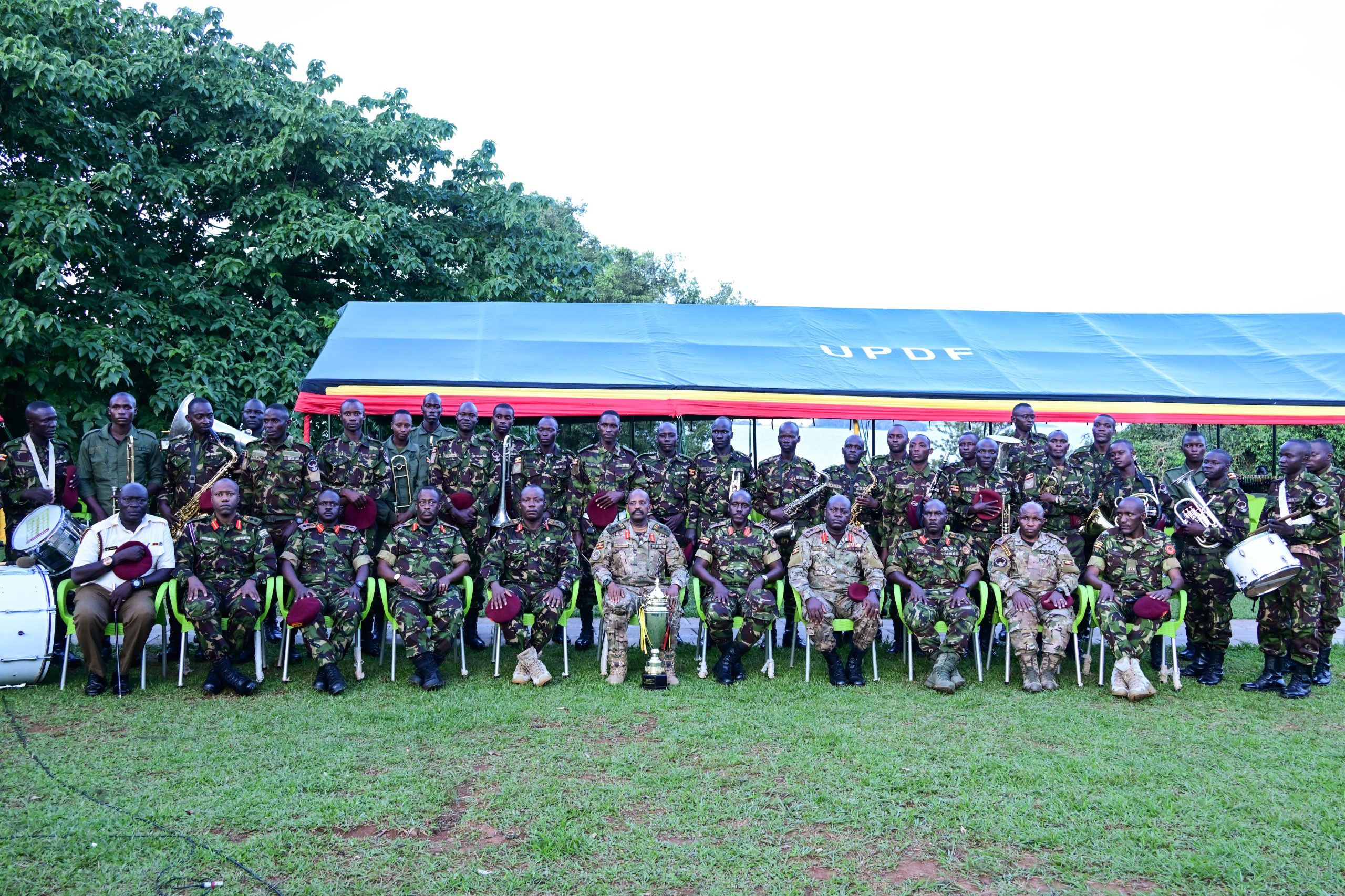 SFC Commander Maj. Gen David Mugisha (seated C) and other senior officers pose for a photo with some of the soldiers during a dinner in honour of SFC soldiers who participated in CDF annual drill competition