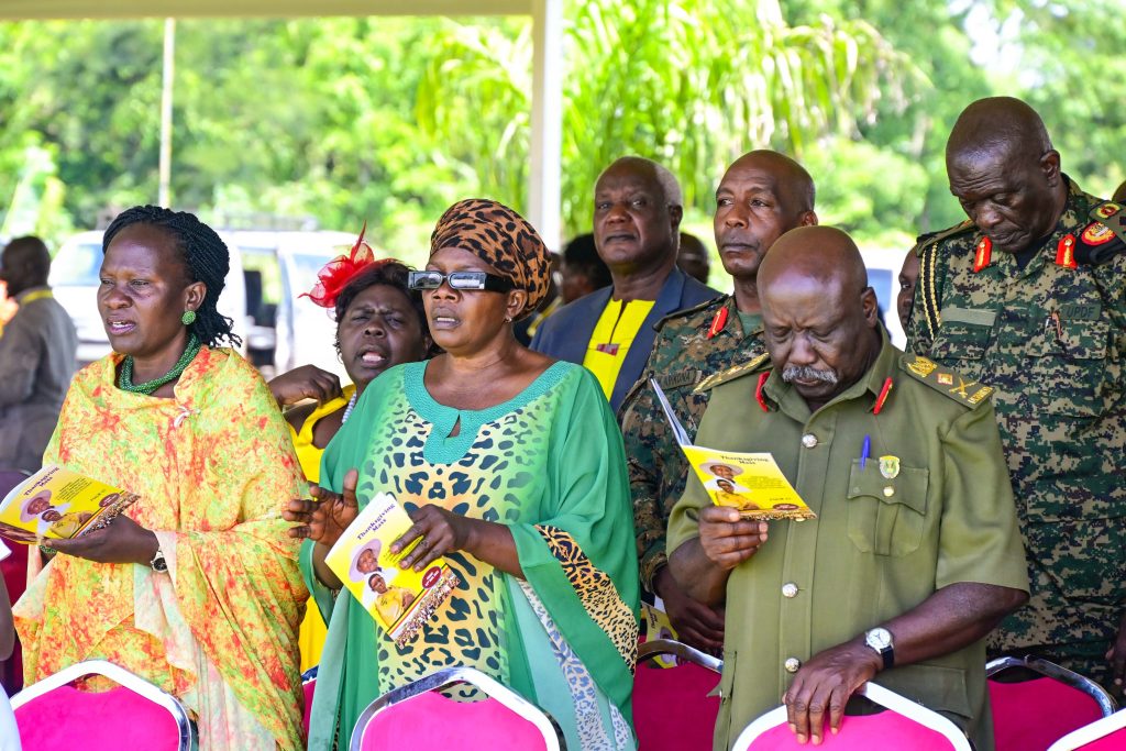 Some of the guests singing praise hyms during Hon Mary Mugasas thanksgiving ceremony in Kimbugu in Kikube district on Friday PPU Photo - State House Uganda President Museveni At A Thanksgiving Ceremony For Hon. Grace Mary Mugasa, The Minister Of State For Public Service, Held At Kisaaru-Kyabayanja Village, Kimbugu Parish In Kabwoya Sub-County, Kikuube District – 24-May-2025