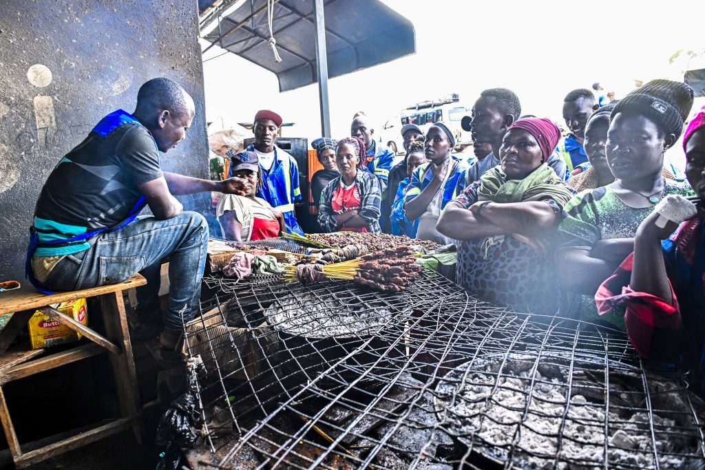 Walugembe Fulujensiyo roosting goat meat and his going to boost his business after receiving President Yoweri Kaguta Museveni’s financial support at Lukaya Road Toll market in Lukaya Town in Kulungu district on the 12th August 2025. Photo by PPU/Tony Rujuta.