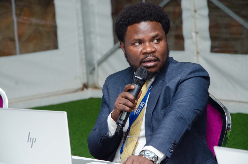 Desmond Tutu Opio, Senior Monitoring & Evaluation specialist Uganda Energy Credit Capitalisation Company (UECCC) speaking. PPU PHOTO.