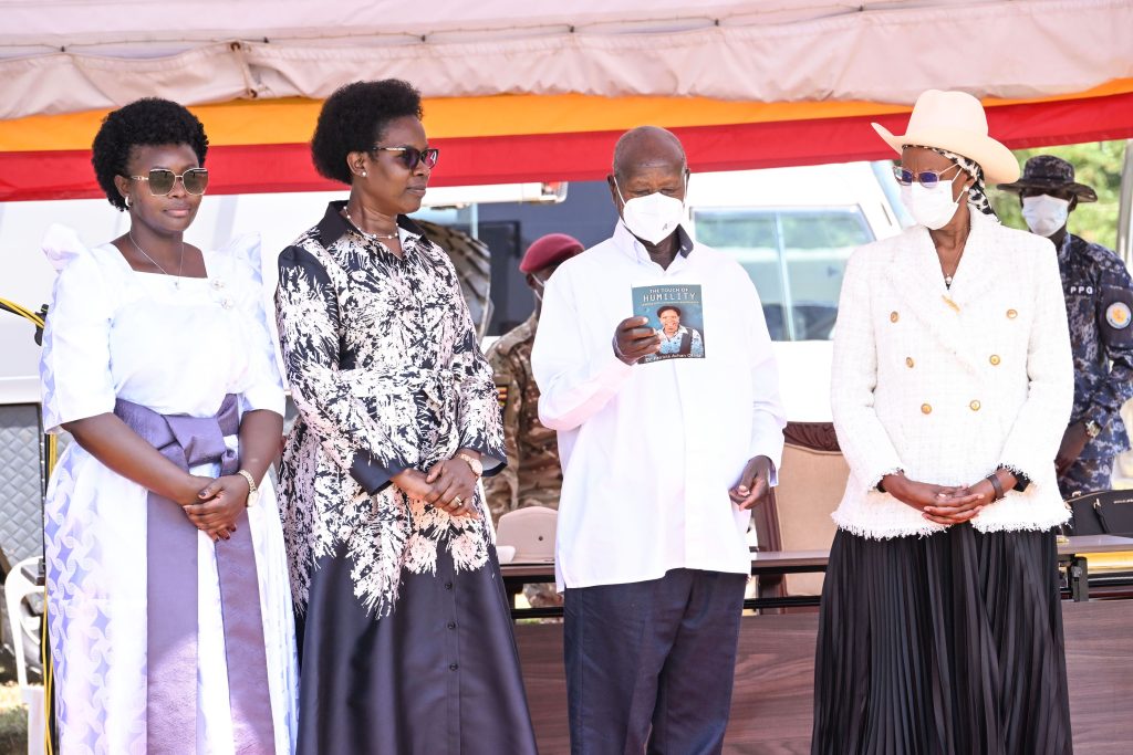 President Museveni launching Deputy IGG Dr. Patrocia Okiria's book (2nd L) as First Lady Janet Museveni (R) and Hon Lillian Aber (L) look on during Archbishop Janan Luwum Day 2026 in Kitgum