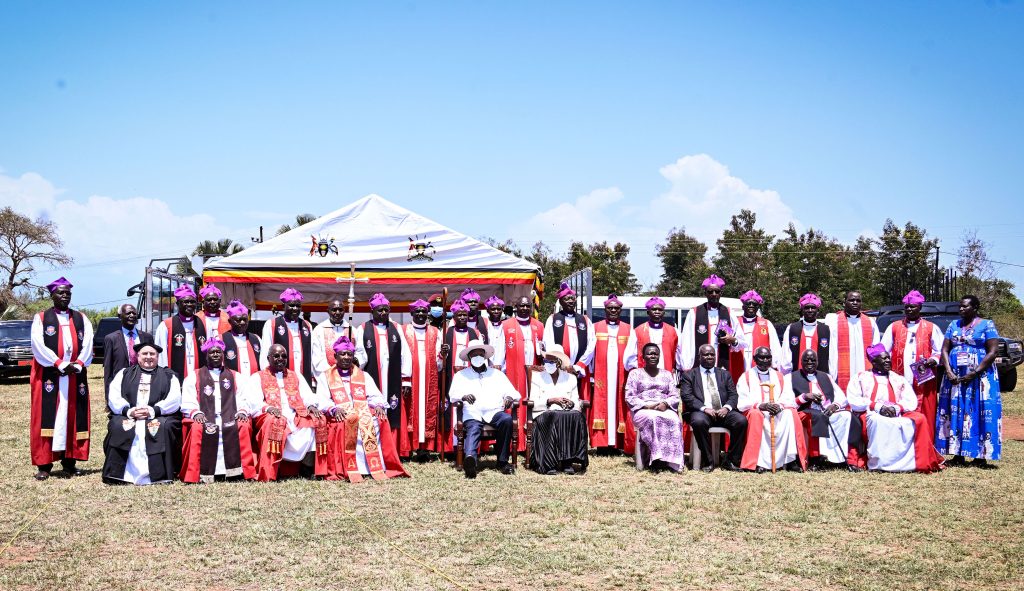 President Museveni and First Lady Janet Museveni pose for a photo with Anglican Bishops during Archbishop Janani Luwumu Day in Mucwuni, Kitgum on Monday. PPU Photo