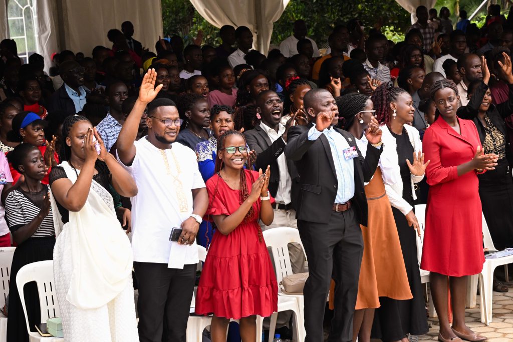 Members of the congregation go into moments of praise and worship during the commissioning of Life Restoration Ministries Church at Bujuko on Saturday. PPU Photo.