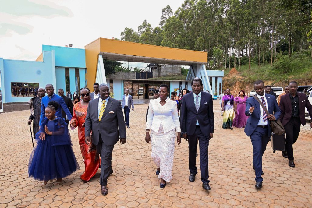 Pastor Kenneth Kato (L) taking Hon Beatrice Akello the State Minister for Economic Monitoring and Pastor Robert Kayanja (R) on a guided tour of Life Restoratio (2)